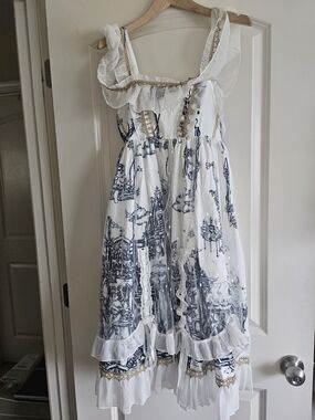 White and Navy Ruffle-Trim Dress With Gold Accents